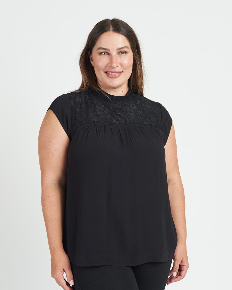 Front of a model wearing a size 2X Tatiana Cap Sleeve Blouse with Lace Yoke in BLACK by Daniel Rainn. | dia_product_style_image_id:272087